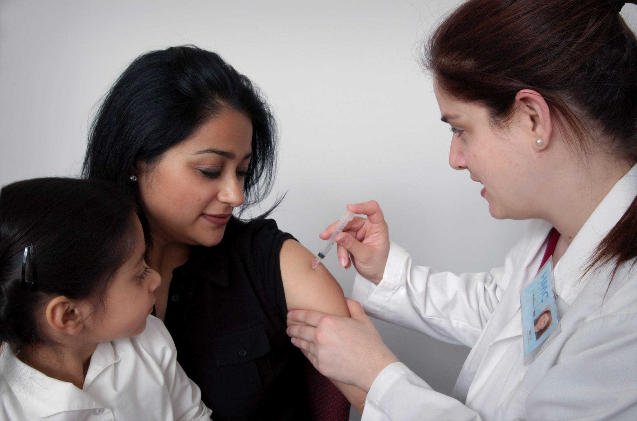 Doctor giving patient a shot